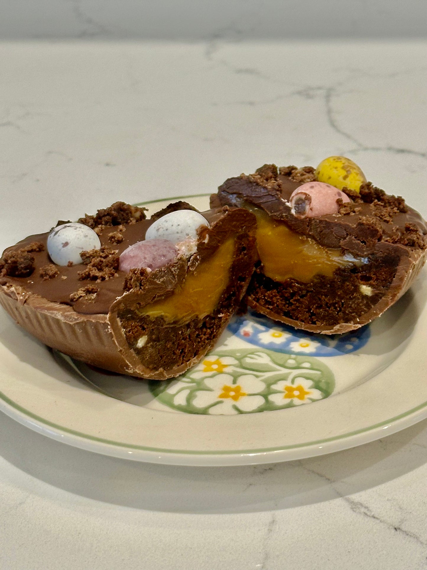 Half a chocolate Easter egg filled with cookies and cream filling or salted caramel.