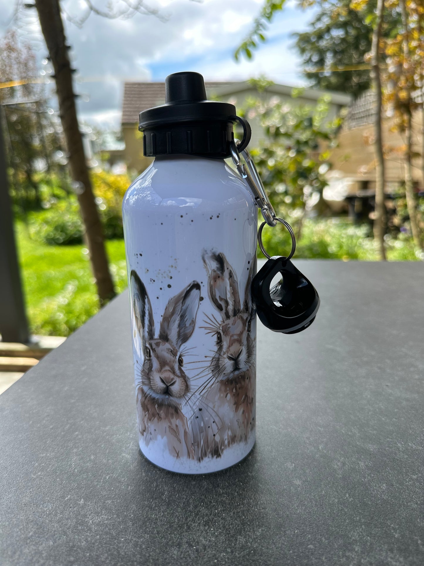 Hare design water bottle with two lids