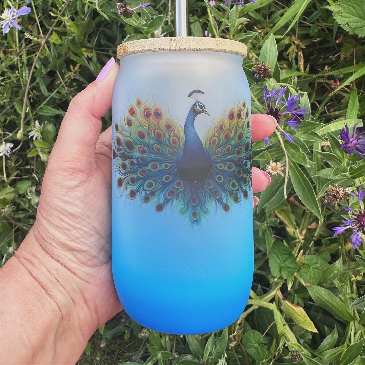 Blue ombré glass tumbler with peacock design