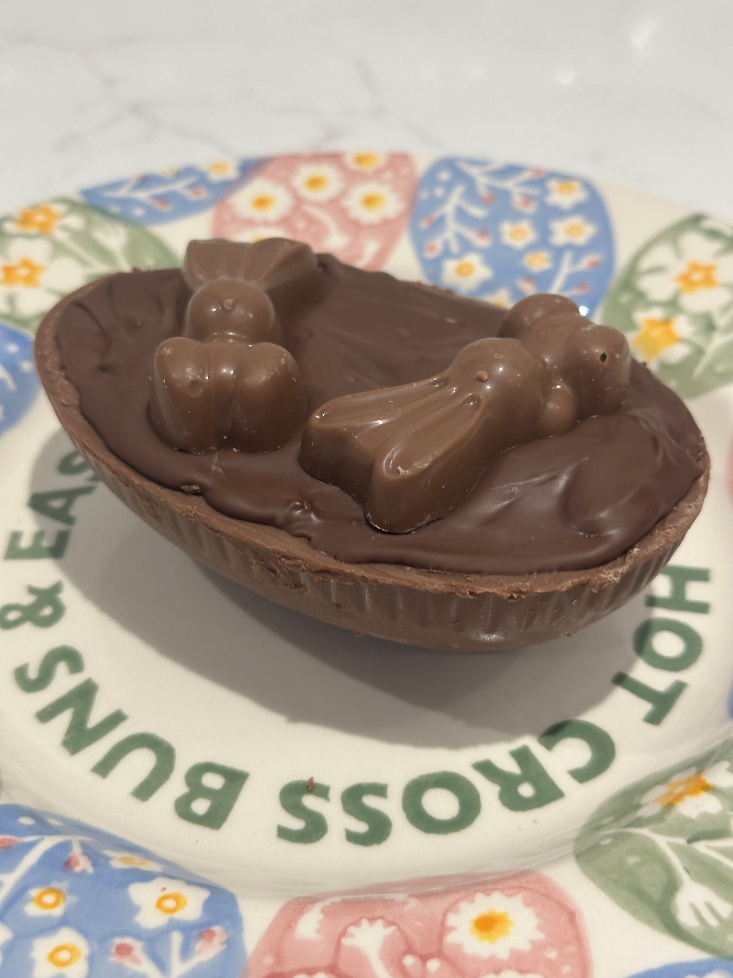 Half a chocolate Easter egg filled with cookies and cream filling or salted caramel.