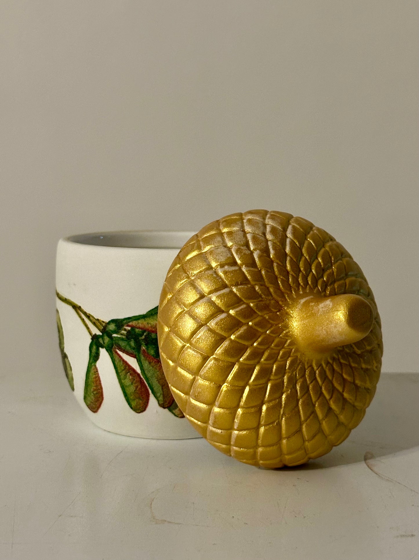 Ceramic acorn pot with gold lid