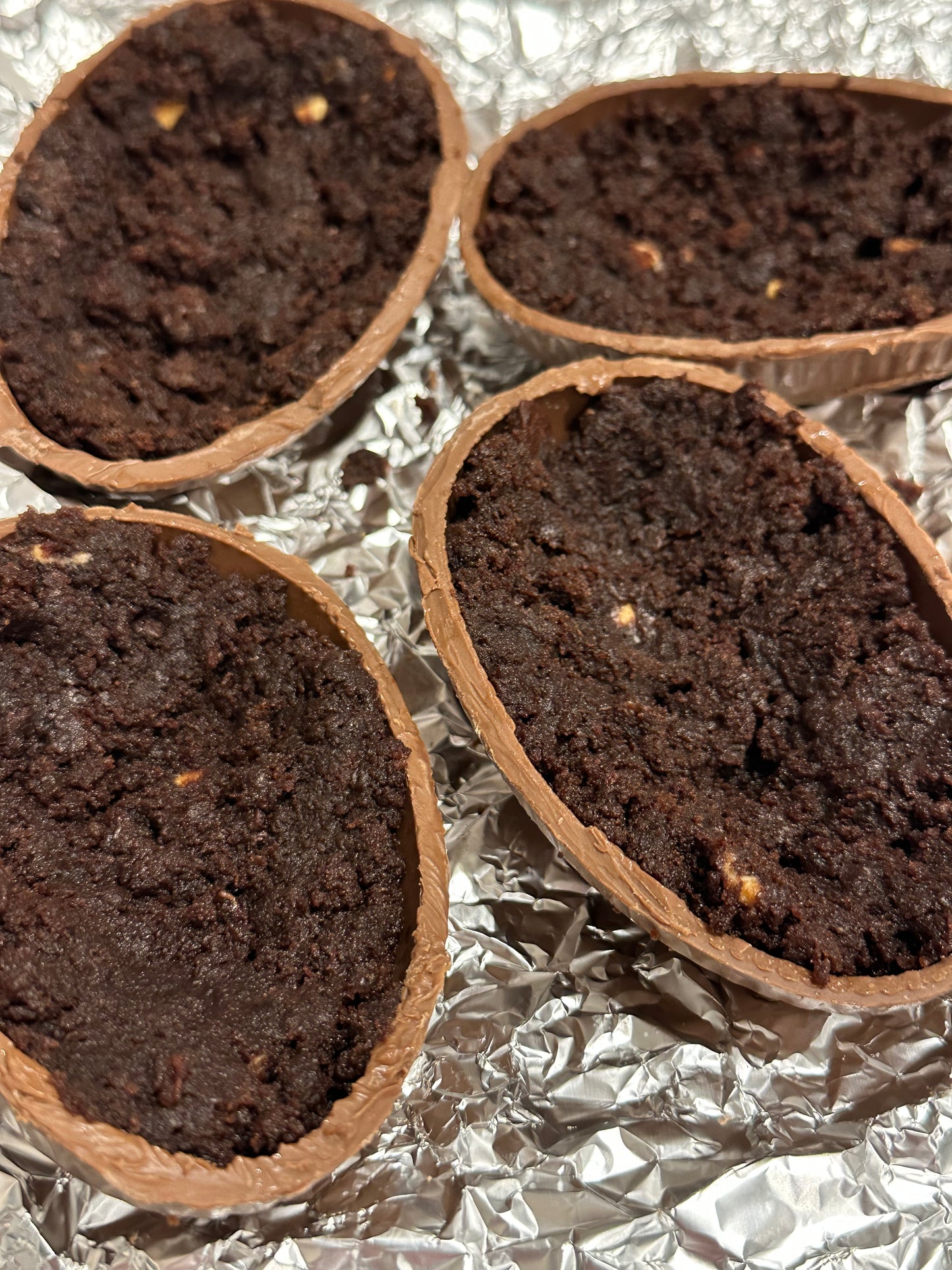 Half a chocolate Easter egg filled with cookies and cream filling or salted caramel.