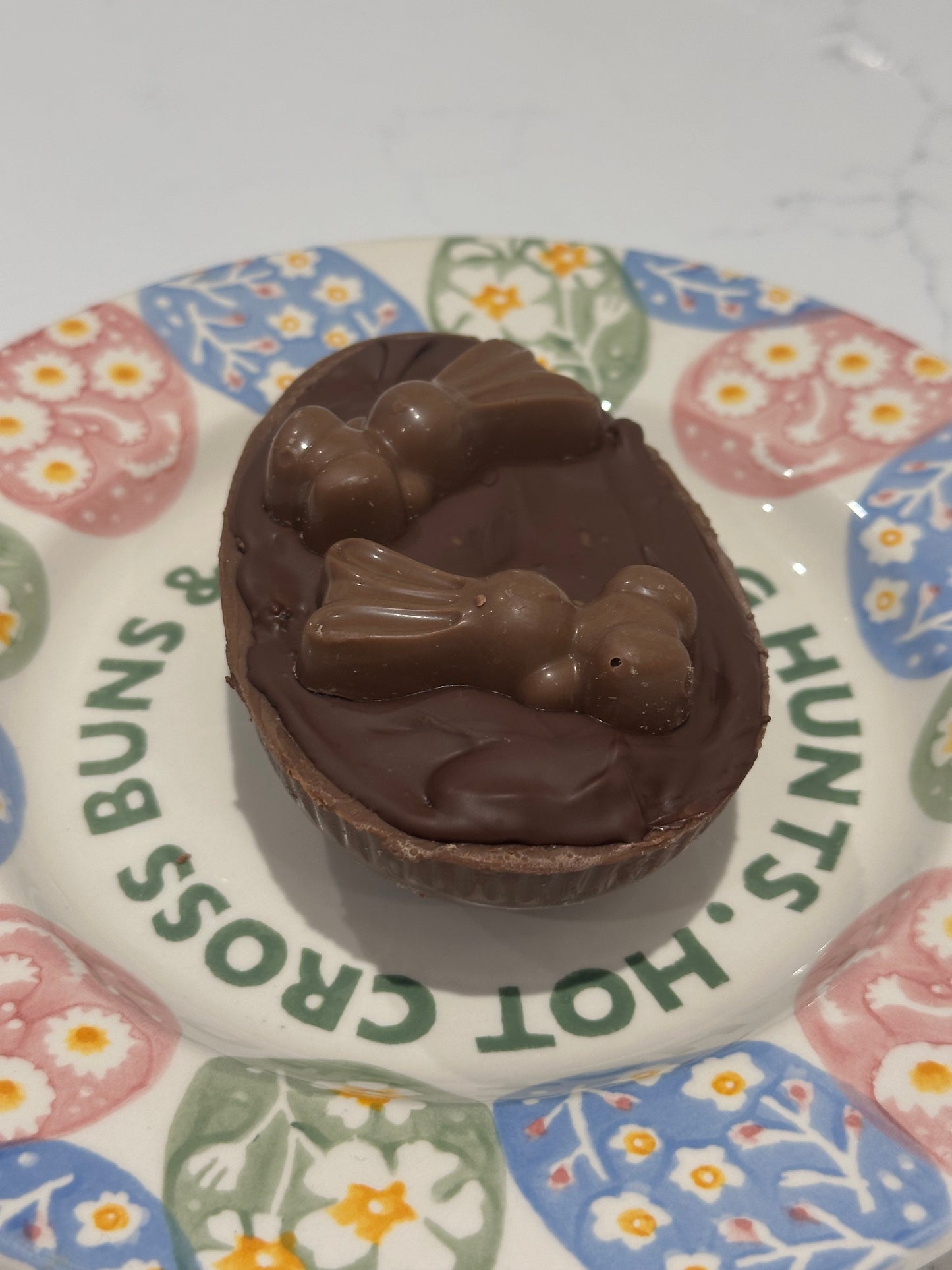 Half a chocolate Easter egg filled with cookies and cream filling or salted caramel.