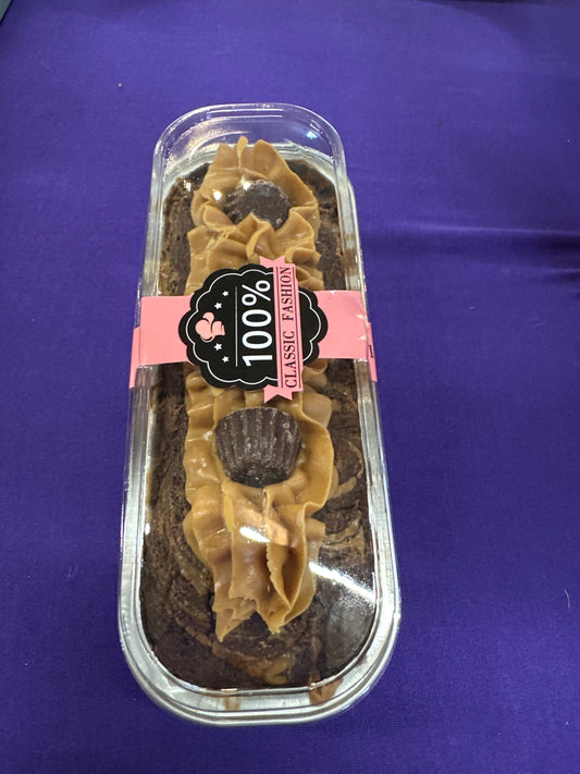 Brownie and Reece tray bake, topped with Reece filling and mini reece or cornflake topped chocolate sponge with ganache