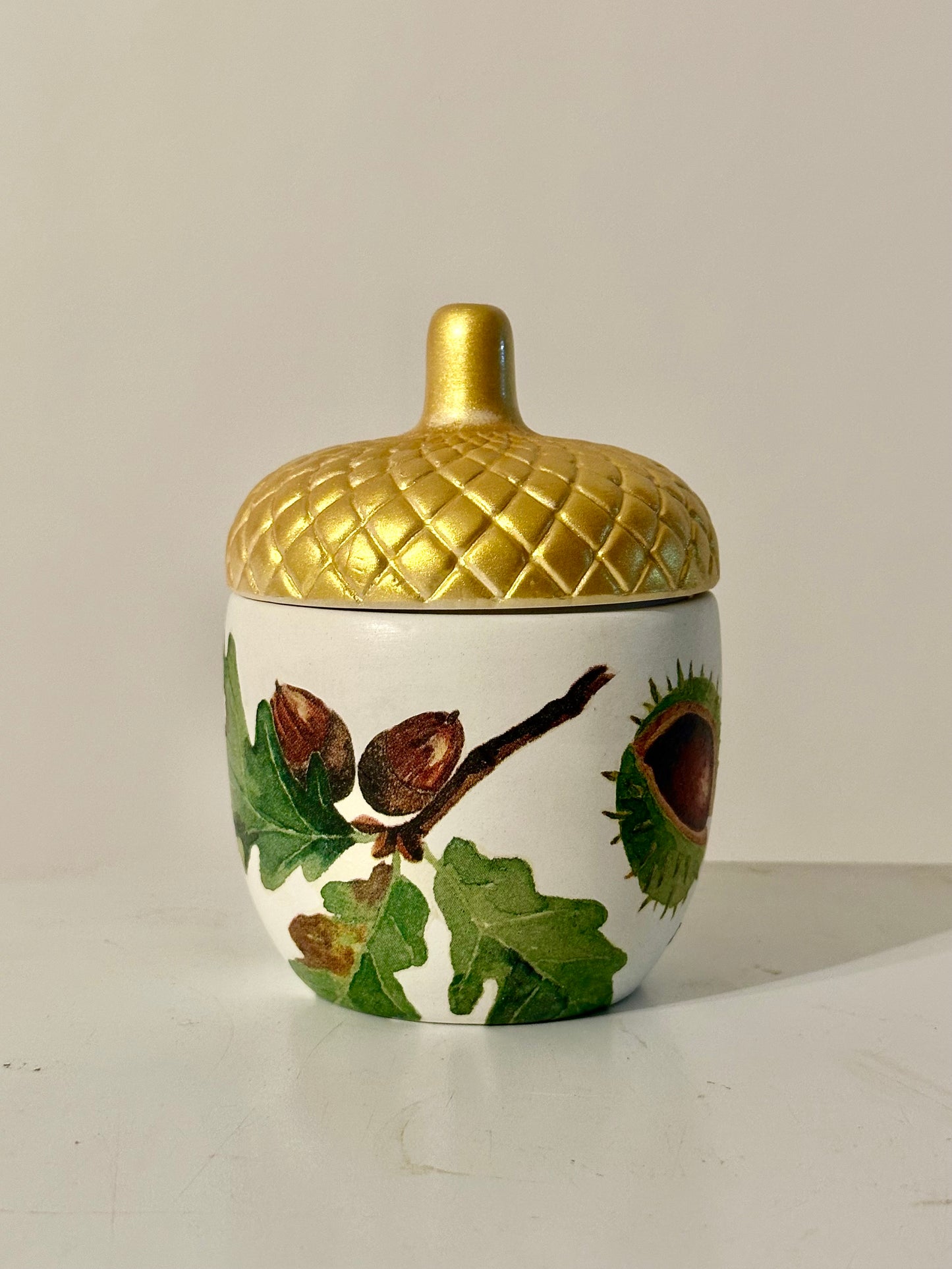 Ceramic acorn pot with gold lid