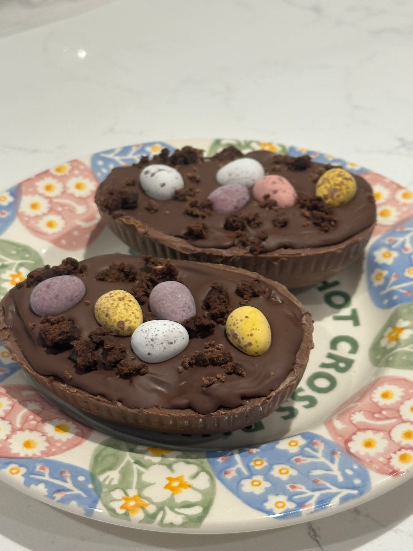 Half a chocolate Easter egg filled with cookies and cream filling or salted caramel.