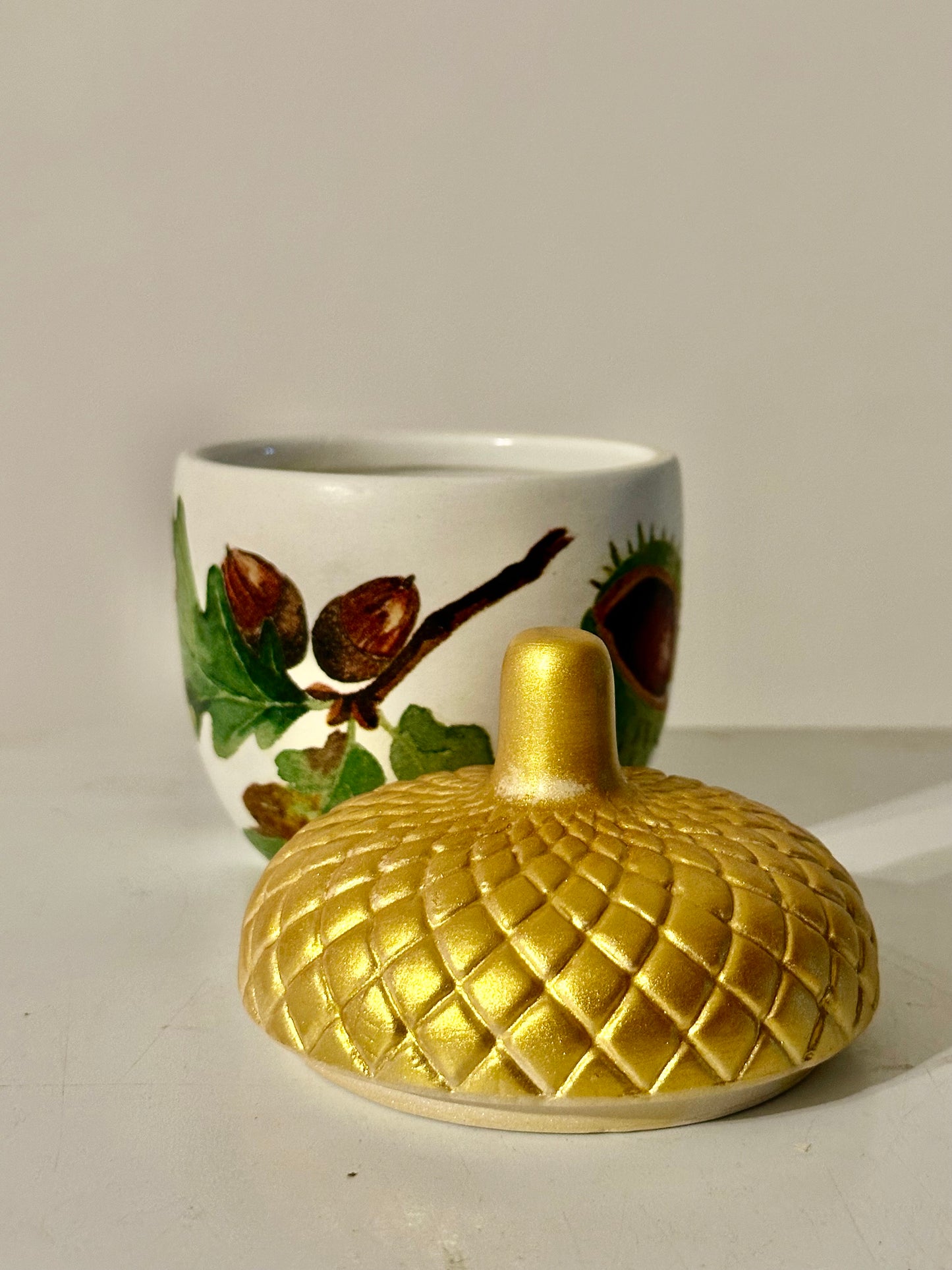 Ceramic acorn pot with gold lid