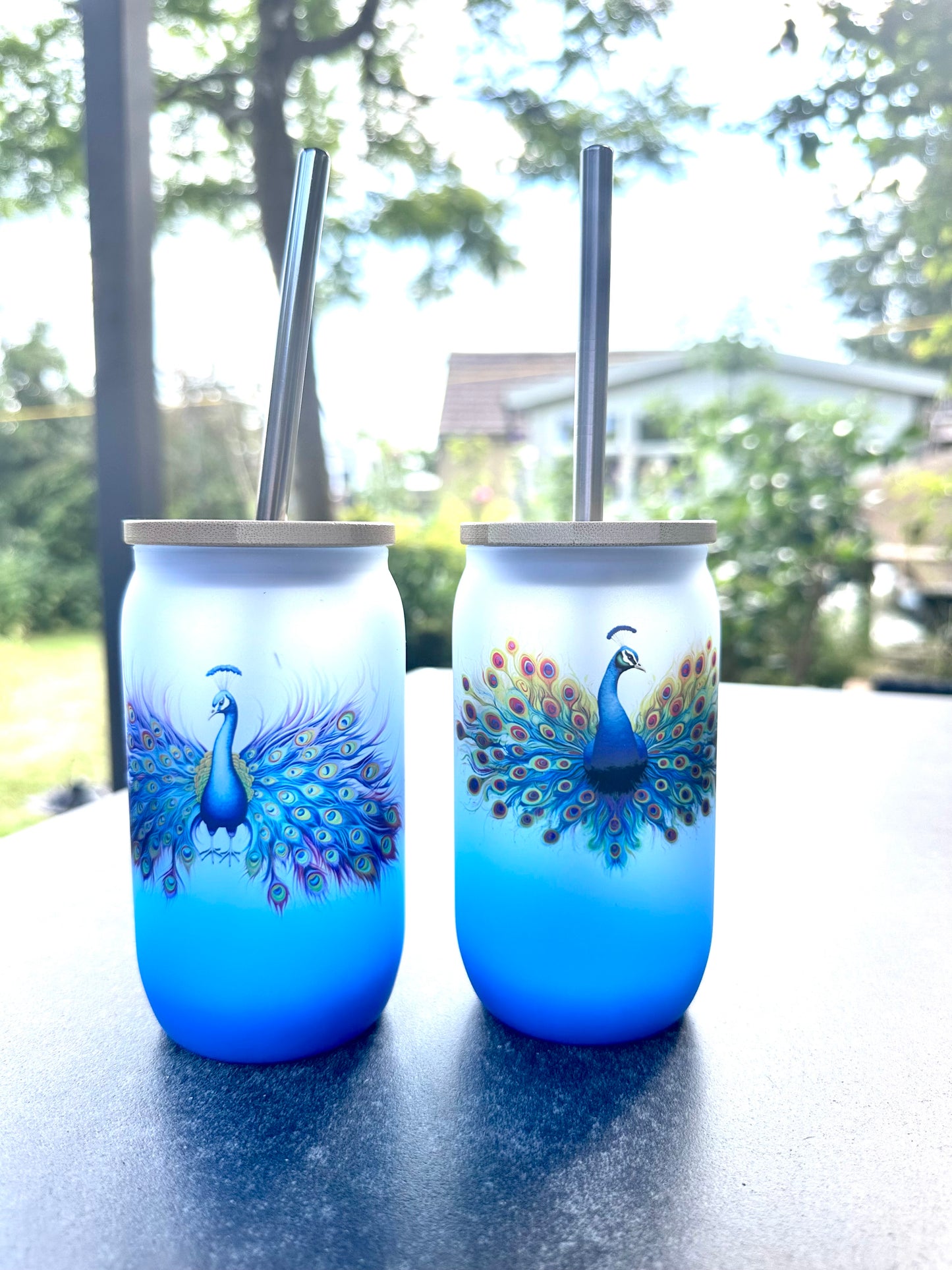 Blue ombré glass tumbler with peacock design