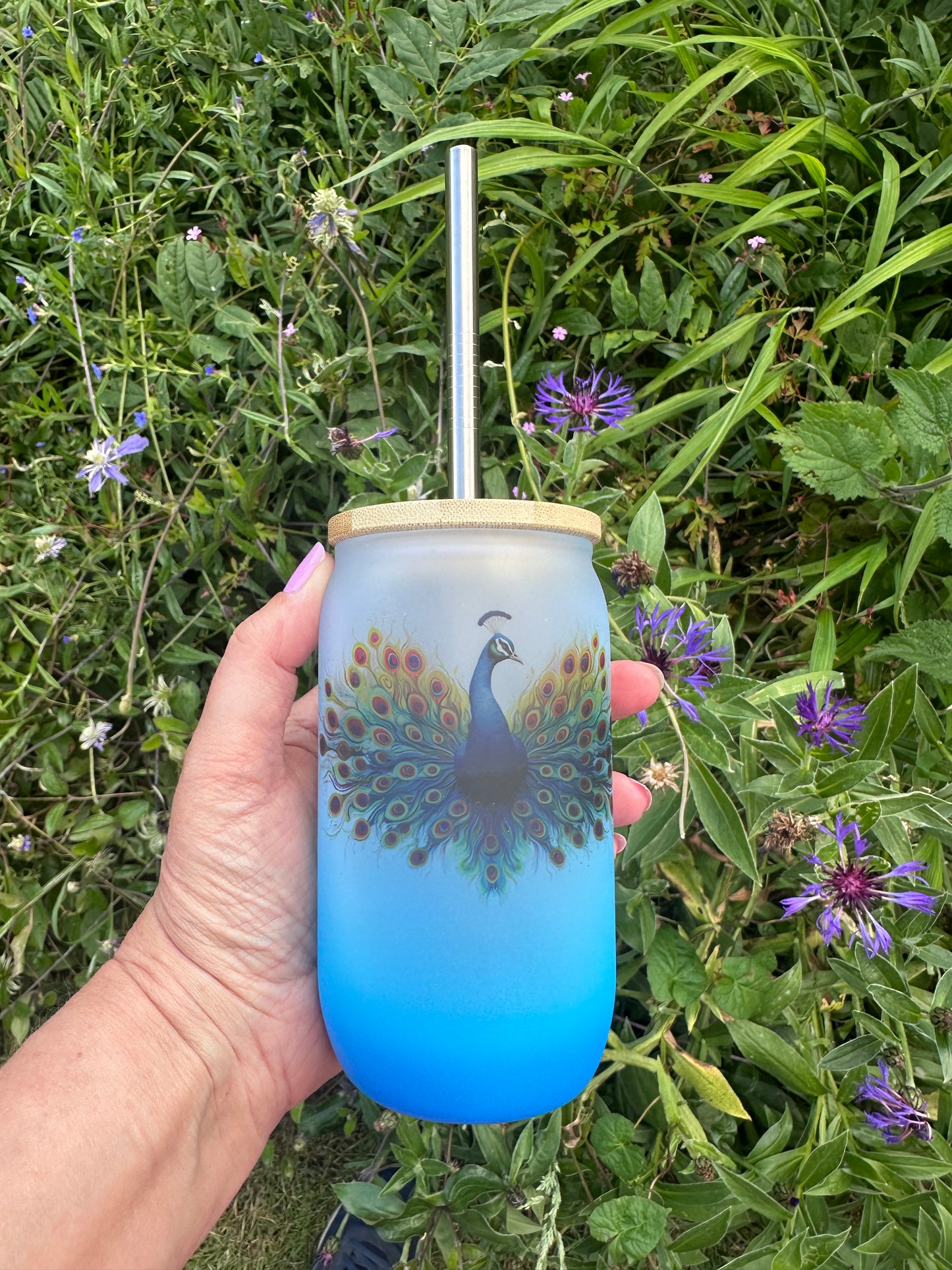 Blue ombré glass tumbler with peacock design