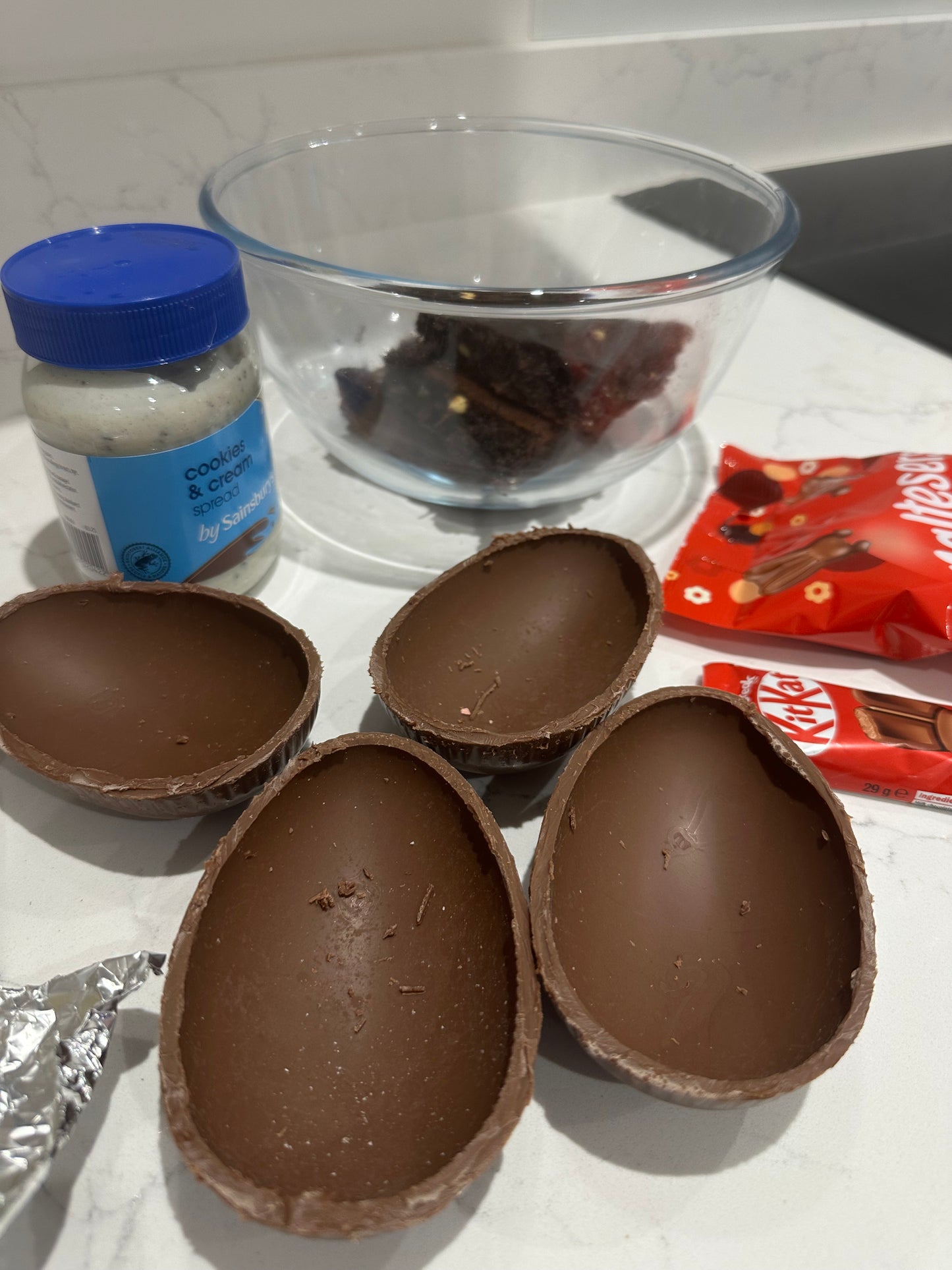 Half a chocolate Easter egg filled with cookies and cream filling or salted caramel.