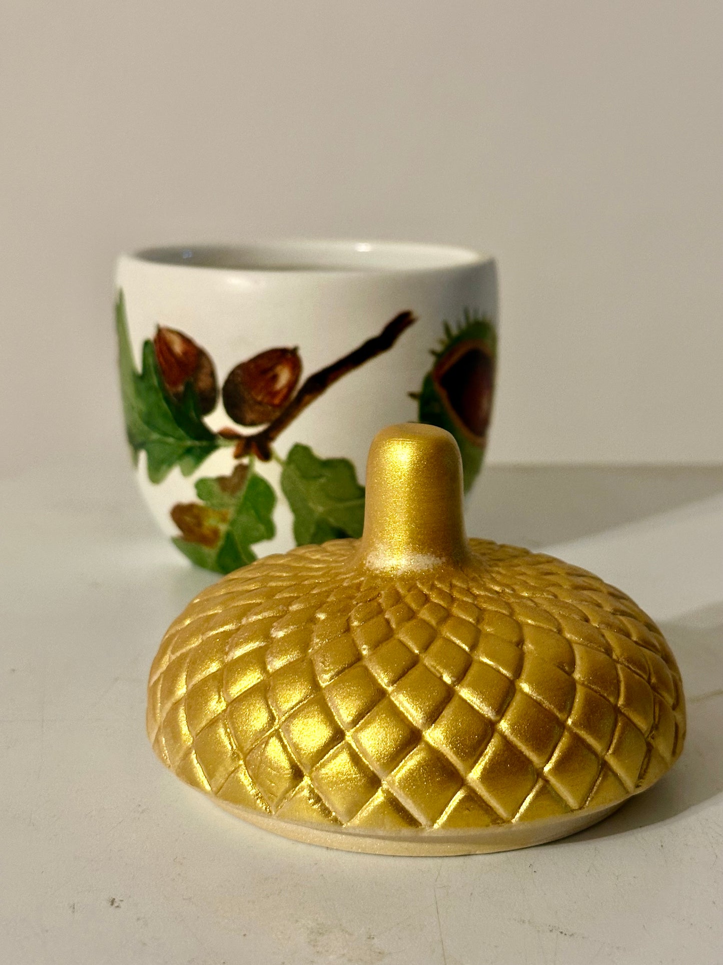 Ceramic acorn pot with gold lid