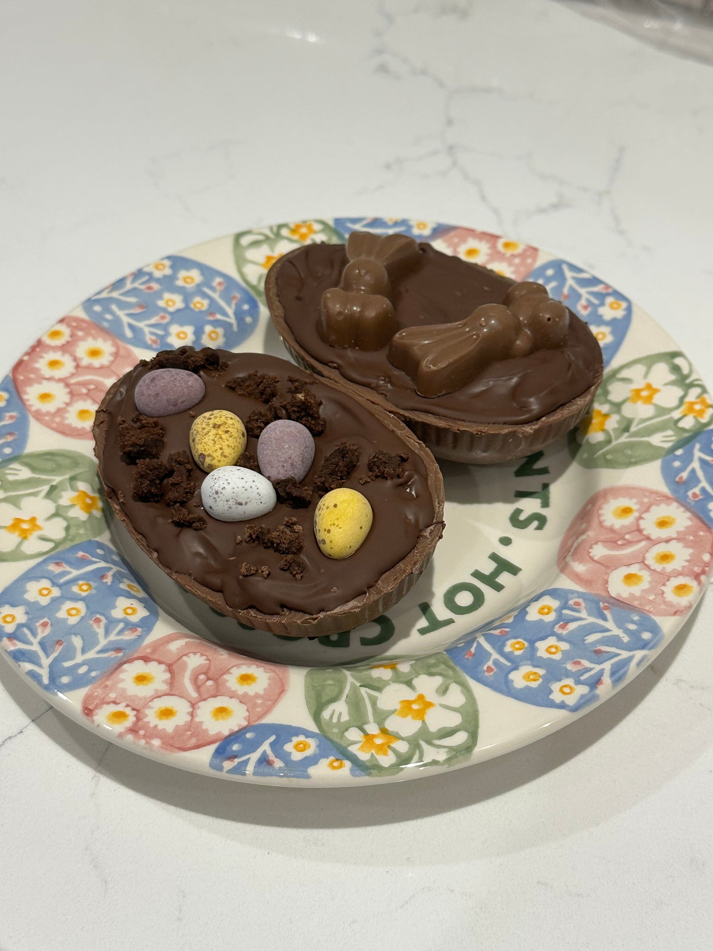 Half a chocolate Easter egg filled with cookies and cream filling or salted caramel.