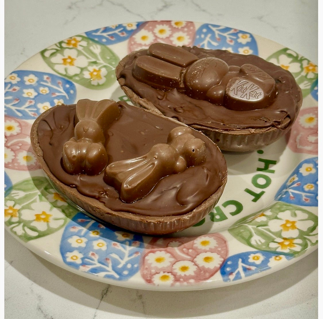 Half a chocolate Easter egg filled with cookies and cream filling or salted caramel.