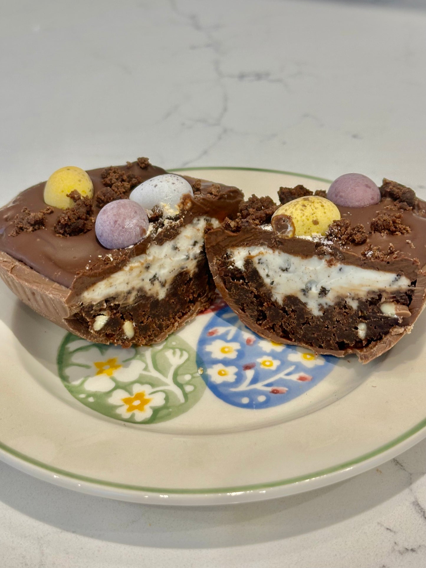 Half a chocolate Easter egg filled with cookies and cream filling or salted caramel.
